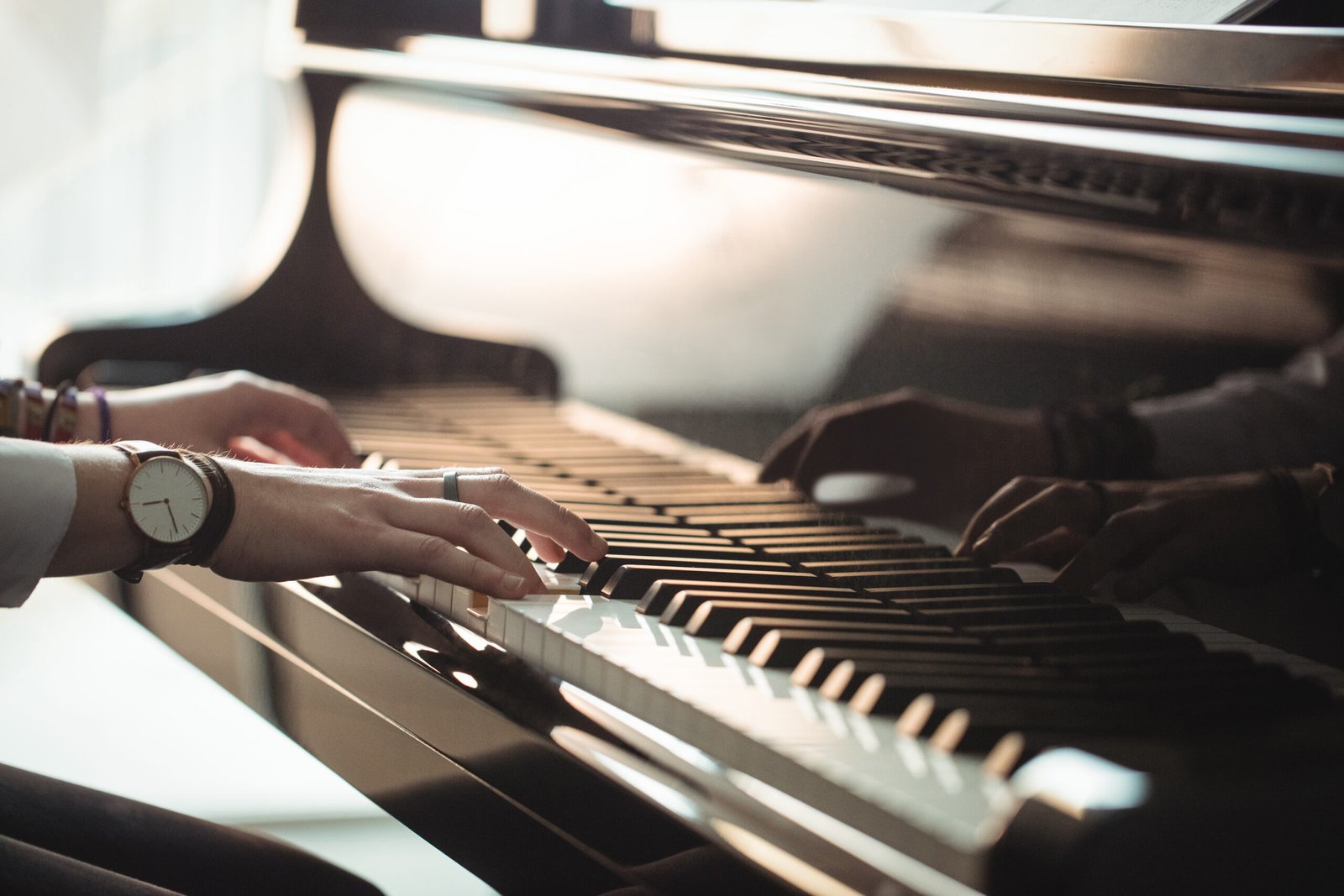 Woman playing a piano in music studio